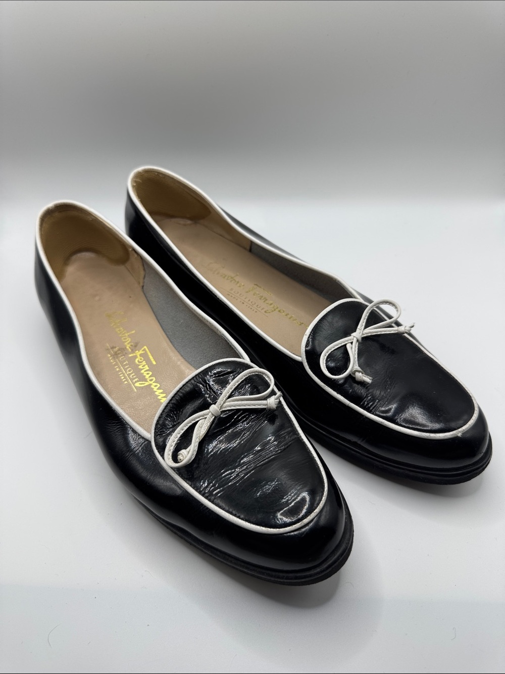Salvatore Ferragamo Black Leather Bow-Trim Loafers with White Piping
